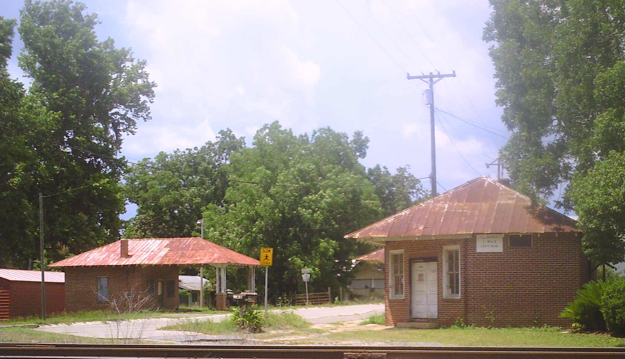 Note:  The picture above is the old filling station on the left and the post office and a grocery store on the right.